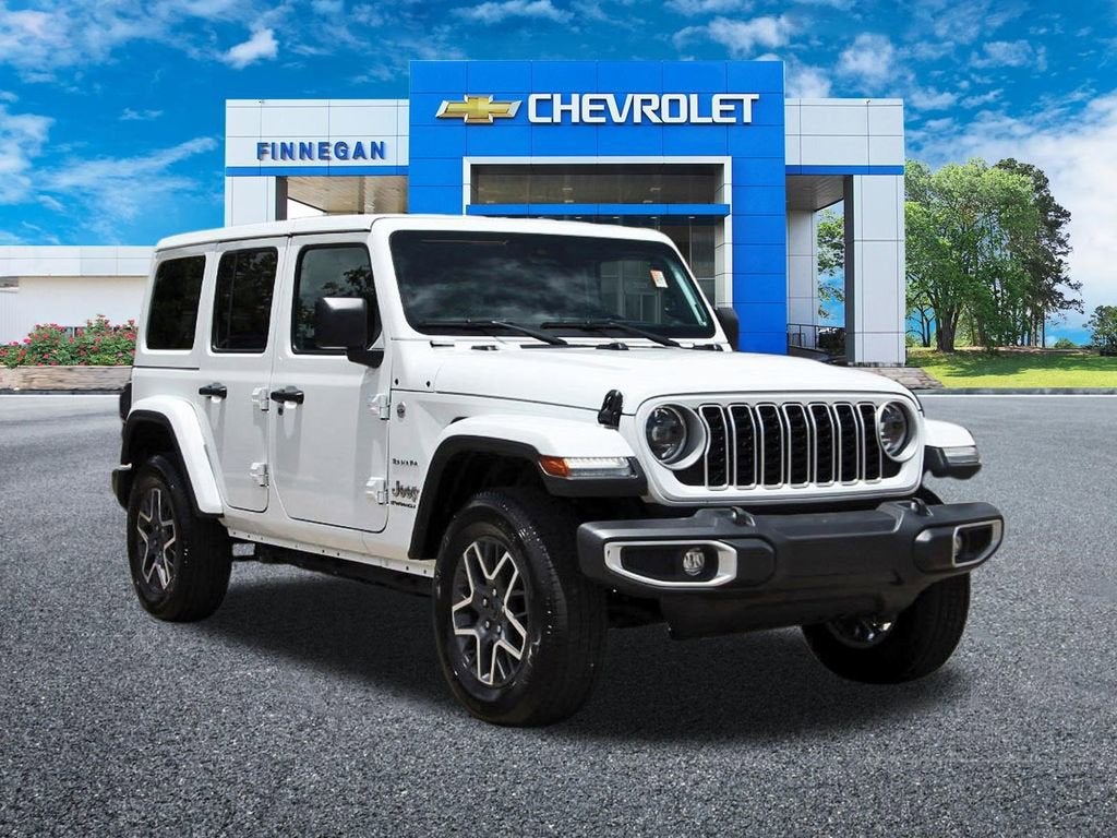 2024 Jeep Wrangler Sahara in White — front three-quarter view