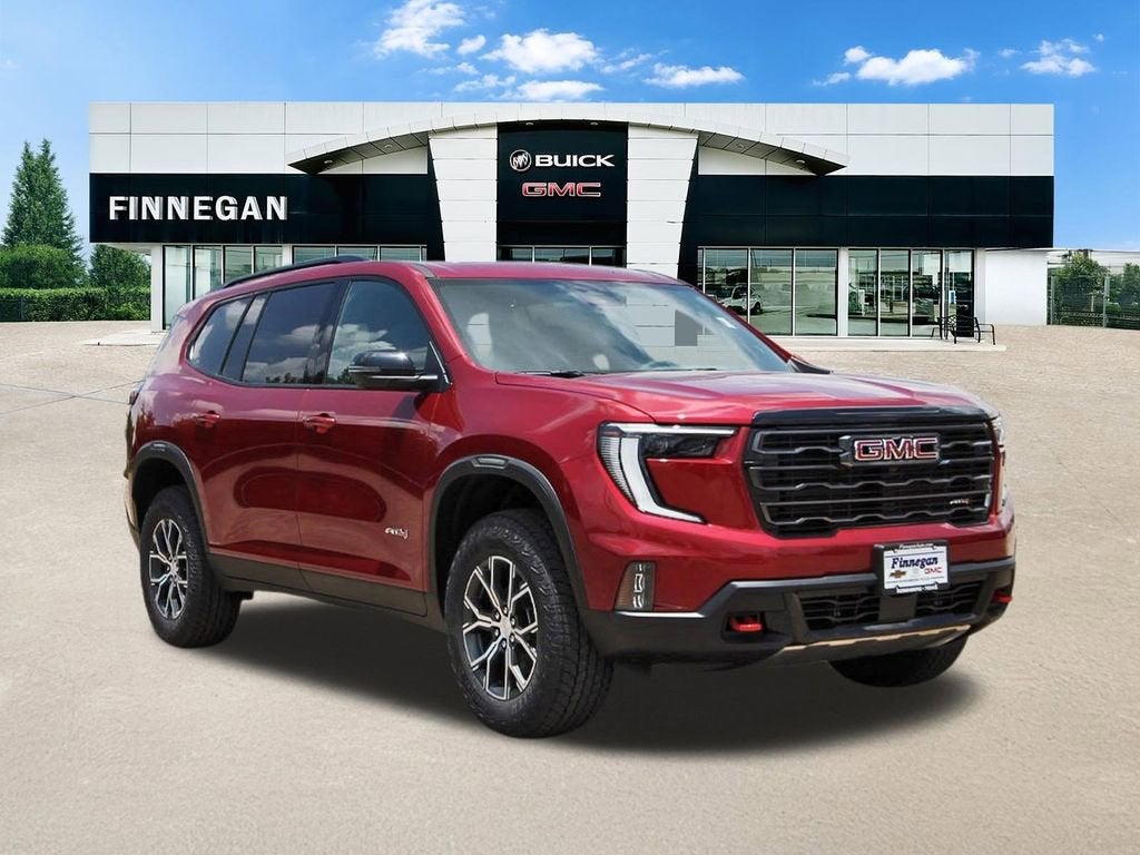 2026 GMC Acadia AT4 in Volcanic Red Tintcoat — front three-quarter view