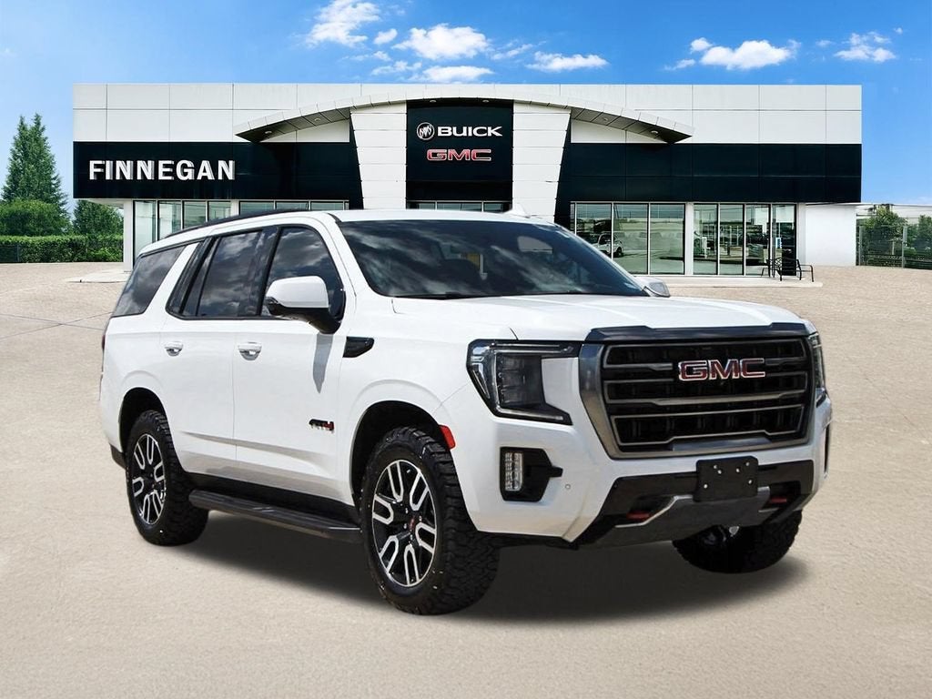 2024 GMC Yukon AT4 in Summit White — front three-quarter view