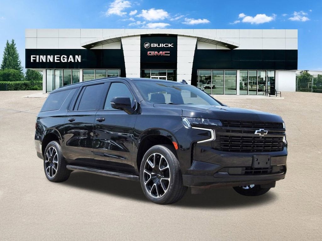 2024 Chevrolet Suburban RST in Black — front three-quarter view